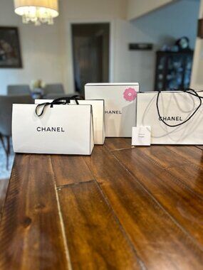 Authentic Chanel gift bags, box and charm